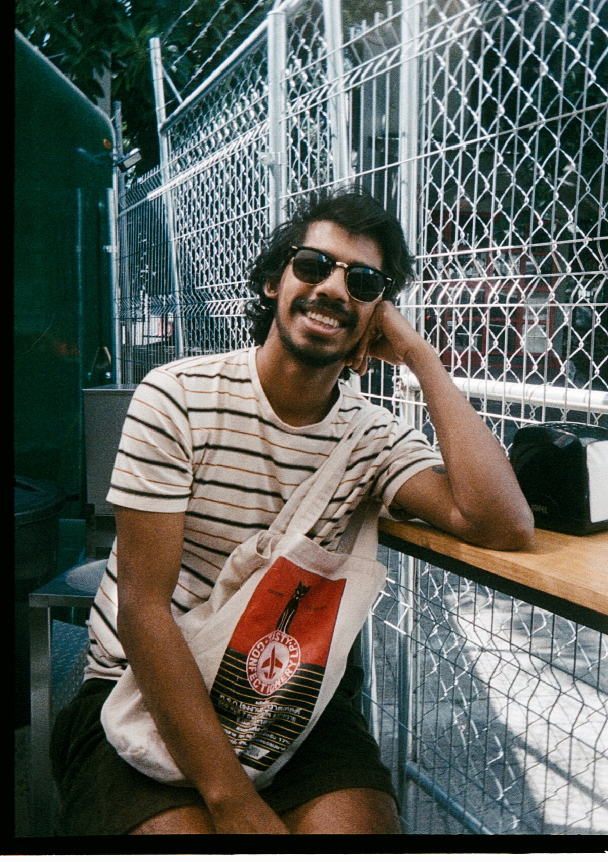 Portrait of Tareque smiling, wearing sunglasses